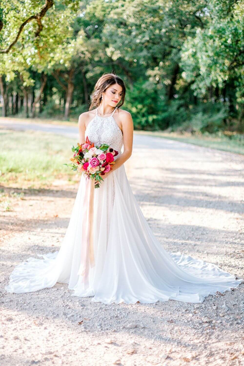 Bride holding pink bouquet in an A-line Wedding Dress photo by Elizabeth Couch Photography