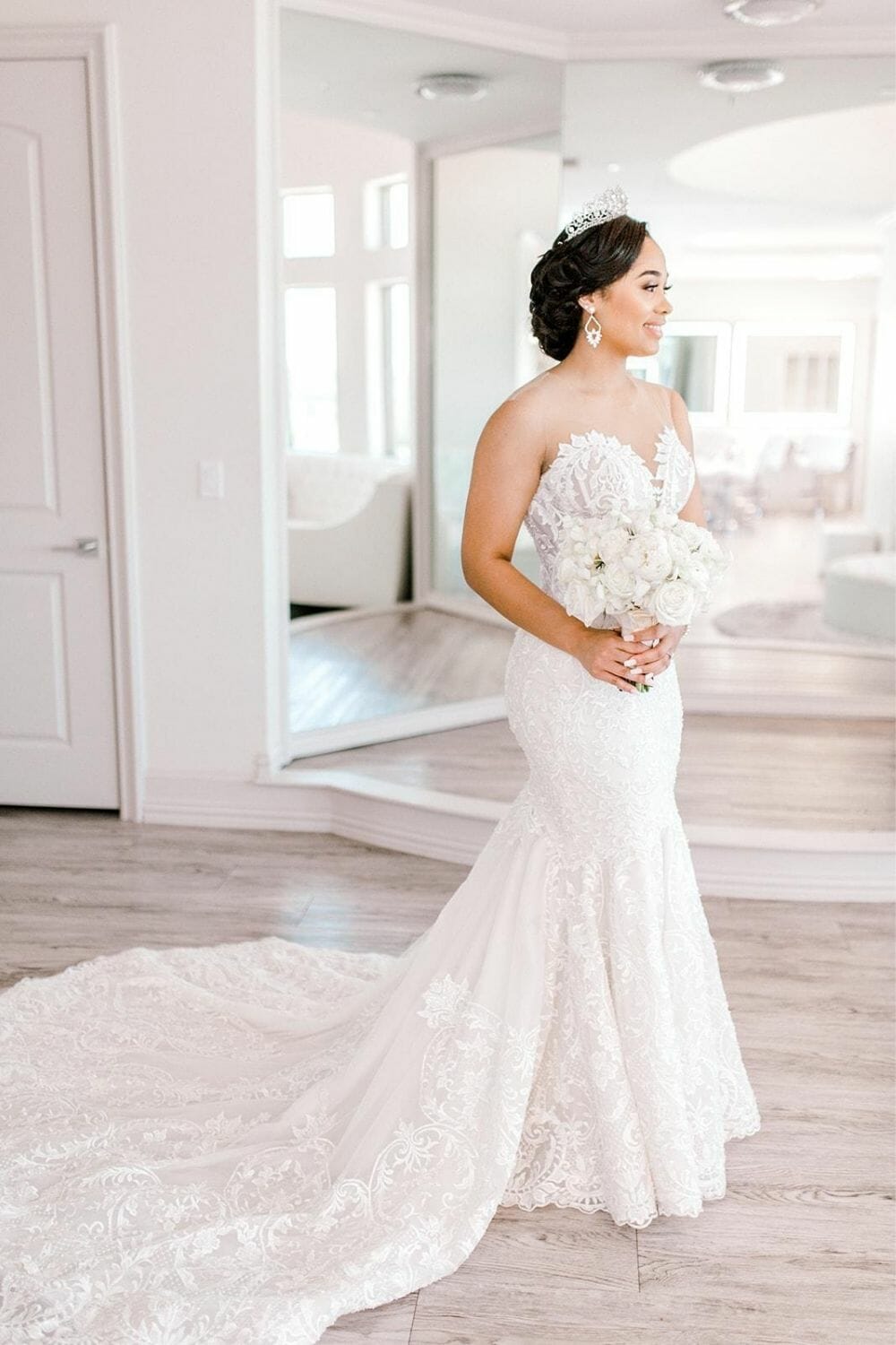 Bride with white bouquet in a Trumpet-Mermaid Wedding Dress photo by Michelle Lippert Photography