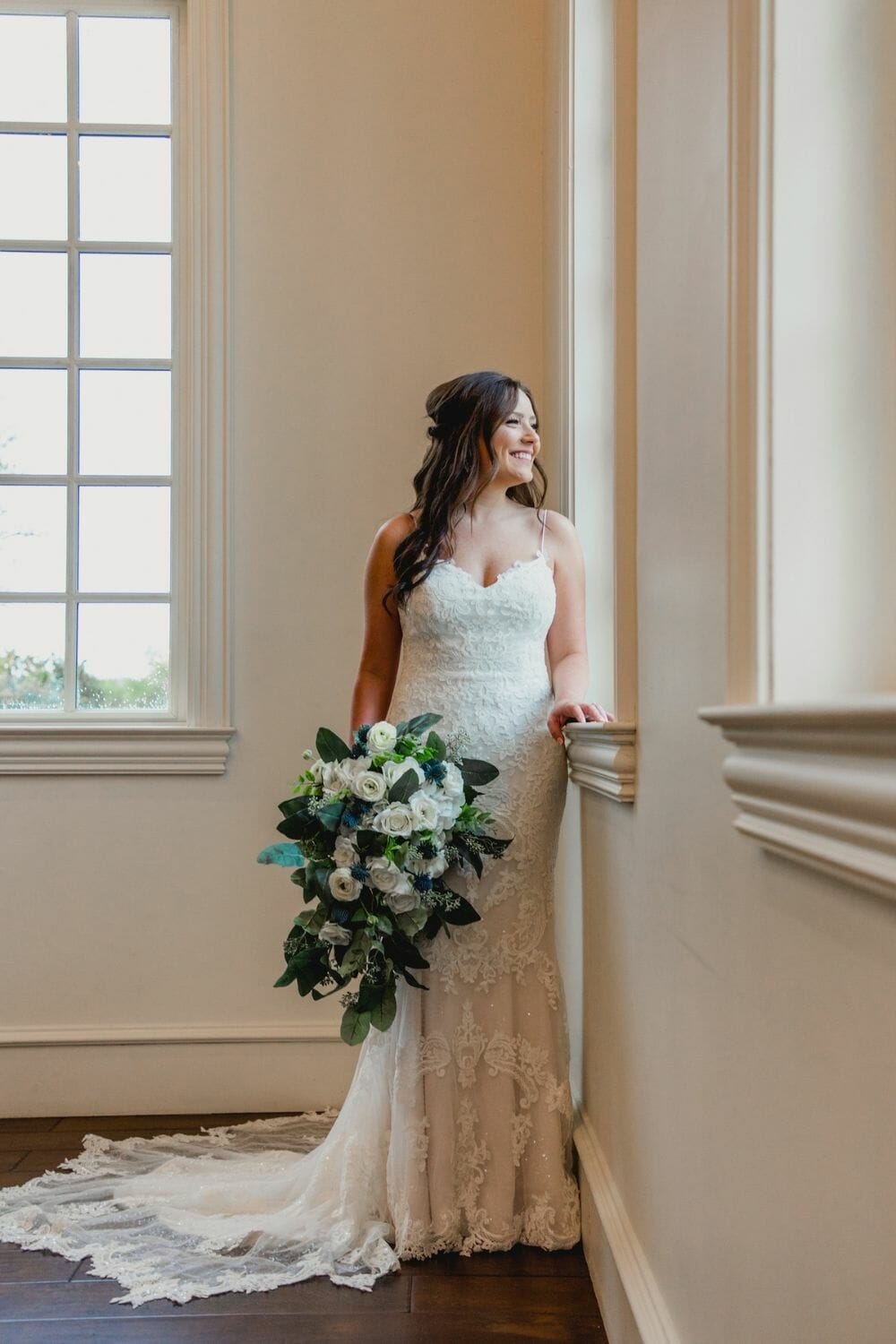 Bride with white flower bouquet in a Trumpet-Mermaid Wedding Dress photo by Cortnie Dee Photography